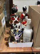 Four ceramic decanters modelled as soldiers, a Staffordshire spill vase and an ammonia bottle.