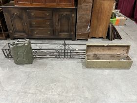 A wrought iron window box, 96" long; a 1950s military jerry can and a box of tools.