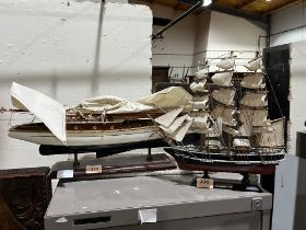 A model sailing cruiser; the hull 20" long, with another sailing ship.