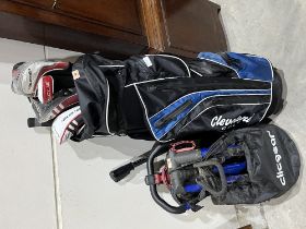 A bag of golf clubs with a folding trolley.