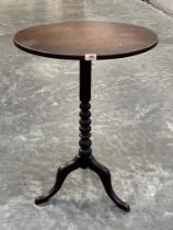 A 19th century mahogany snap-top lamp table on tripod support. 21½" wide.