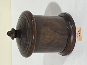 A 19th century lignum string box with domed cover. 7¼" high.