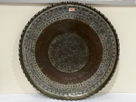 An Islamic silvered copper tray. 28" diam.