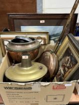 A box of brass and copperware with four framed prints.