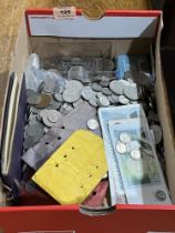 A box of coins and banknotes.