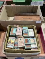 Sets and part sets of cigarette cards in boxes with loose cards.