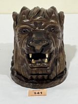 A carved wood lion head inkwell. 5½" high