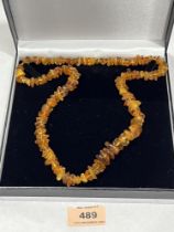 A necklace of amber naturalistic beads. 26" long, 46.7g.