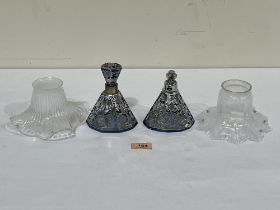 Two Victorian Vaseline glass lampshades an overlaid glass scent bottle and atomiser.