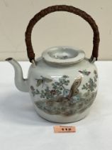 A Chinese porcelain teapot and cover, decorated with foliage and flying insects to one side and