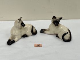 Two Royal Doulton models of Siamese cats. No.1558. 7¼" long.