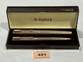 A cased Parker 9ct fountain pen and ballpoint pen en-suite.