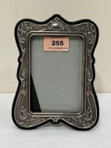An Art-Nouveau style silver fronted photograph frame. 7" high.