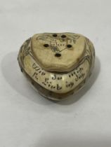 A 19th century Tyrolean Vipiteno horn heart form snuffbox engraved with motto, a lady at a well, a