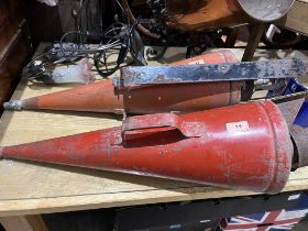 Two vintage fire extinguishers.