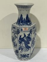 A Chinese hexagonal vase decorated in blue and white with figures or pheasants in reserves. 18"