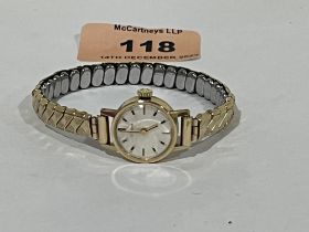 A 9ct cased lady's Eterna wristwatch on plated expanding bracelet.