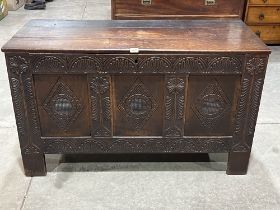 An 18th century joined oak three panel chest, the interior with a till. 48" wide.