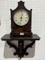 A George IV mahogany bracket timepiece, with associated scrolled wall bracket, a single fusee