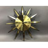 A KIENZLE STARBURST CLOCK, THREE OTHER WALL CLOCKS AND A LAZY SUSAN