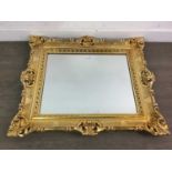 A GILT FRAMED WALL MIRROR AND THREE OTHERS