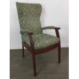 A UPHOLSTERED WINGBACK ARMCHAIR