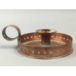 A COPPER CANDLE HOLDER AND TWO OTHERS