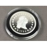 A SILVER FLOWING HAIR DOLLAR AND HALF DOLLAR