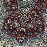 A PERSIAN KIRMAN RUG