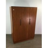 A G-PLAN TEAK THREE DOOR WARDROBE