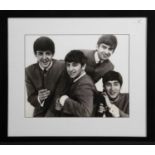 A MONOCHROME PRINT DEPICTING THE BEATLES