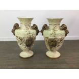 A PAIR OF LATE VICTORIAN DOUBLE HANDLED URN SHAPED VASES