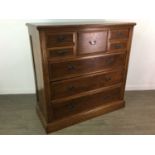 A VICTORIAN WALNUT CHEST OF DRAWERS