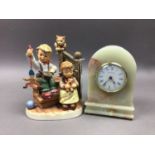 A HUMMEL FIGURE GROUP AND A CLOCK