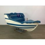 A FAIRGROUND RIDE FIBREGLASS ROWING BOAT