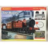 A HORNBY 'THE ROVER' ELECTRIC TRAIN SET AND A PAINT SET