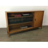 A MID CENTURY TEAK BOOKCASE AND BOOKS