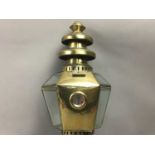 A BRASS WALL MOUNTING OIL LAMP