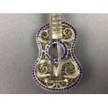 A CONTINENTAL GILT GUITAR BROOCH AND OTHERS
