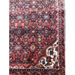 RED GROUND HAMADAN RUG