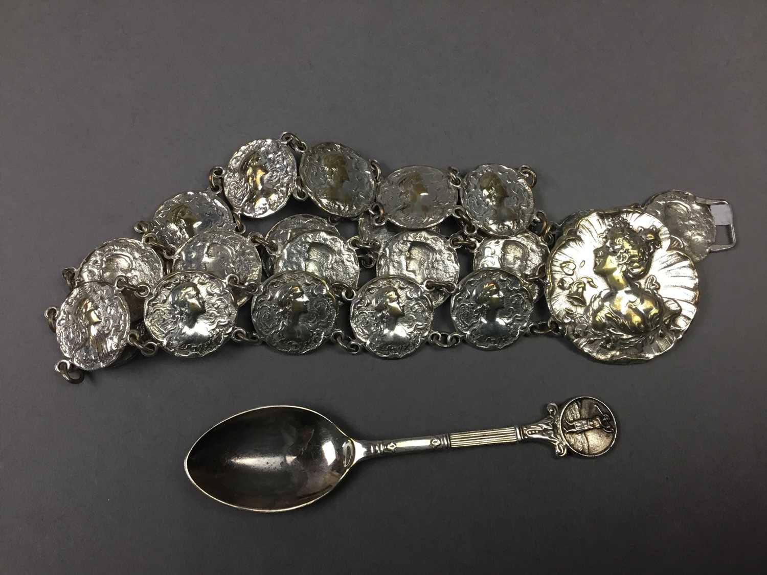 A SILVER BROOCH DEPICTING REYNOLD'S ANGELS, ALONG WITH PLATED BELT AND SPOON - Image 2 of 2