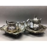 A VICTORIAN SILVER PLATED THREE PIECE TEA SERVICE AND OTHER TEA WARE