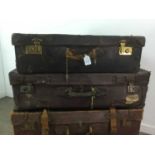A GROUP OF FOUR VINTAGE LEATHER SUITCASES