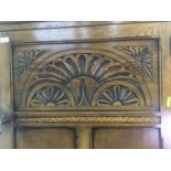 A CARVED OAK HALL WARDROBE