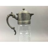 A MOULDED GLASS CLARET JUG WITH PLATED MOUNT