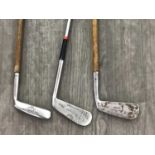 TWO VINTAGE HICKORY SHAFTED PUTTERS AND ANOTHER PUTTER