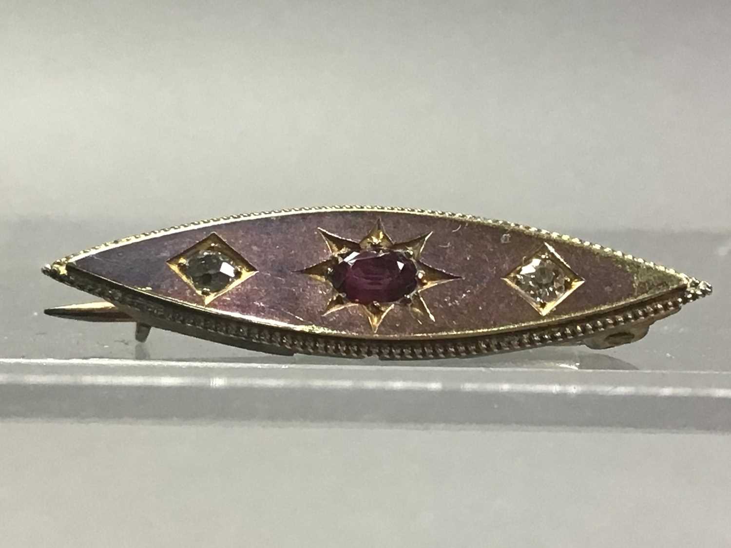 GILT BROOCH WITH OTHER BROOCHES