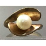 TWO PEARL DRESS RINGS AND TWO OTHERS
