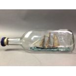 SHIP IN A BOTTLE ALONG WITH A BRASS TRIVET AND TRENCH ART BOX