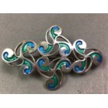 OLA GORIE SILVER AND ENAMEL BROOCH ALONG WITH THREE FURTHER BROOCHES